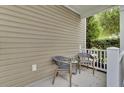 Cozy outdoor patio showcasing two gray chairs, perfect for enjoying quiet mornings or afternoons at 110 Instructor Ct, Ladson, SC 29456