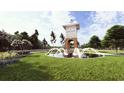 Community entrance featuring a water fountain and landscaping at 140 Lilac Grove Way, Summerville, SC 29486