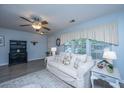 Inviting living room with sofa, decor, ceiling fan, and natural light at 1401 Elm Hall Cir, Summerville, SC 29483
