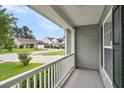 Front porch view featuring a neighborhood street and houses, offers an inviting outdoor space at 173 Southport Dr, Summerville, SC 29483
