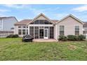 Spacious backyard featuring a screened-in porch and a well-maintained lawn at 193 Cypress Forest Dr, Moncks Corner, SC 29461