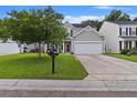 Charming home featuring a spacious front lawn and a traditional mailbox at 2005 Isabela Ct, Summerville, SC 29483
