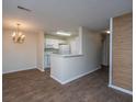 Bright kitchen featuring white appliances and cabinets, open to the dining area with a chandelier at 2011 N Highway 17 # 1400B, Mount Pleasant, SC 29466