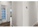 Hallway with neutral walls leads to bathroom and bedroom with natural light shining through window at 215 Cypress Plantation Rd, Moncks Corner, SC 29461