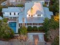 Aerial view of house with pool, screened porch, brick chimney, and manicured landscaping at 222 Haddrell St, Mount Pleasant, SC 29464