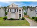 Charming two-story home boasts a bay window, well-maintained landscaping, and a private driveway and garage at 234 Cameron St, Summerville, SC 29486