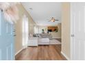 Inviting living room featuring hardwood floors and a comfortable sectional sofa, open to the kitchen at 252 Island Green Rd, Goose Creek, SC 29445