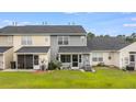 A well-maintained backyard and patio, perfect for relaxation and outdoor entertainment at 402 Pine Bluff Dr, Summerville, SC 29483