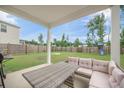 Back porch featuring outdoor seating, a table, and a beautiful view of the backyard and fence at 452 Minim St, Charleston, SC 29414