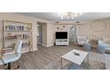 Open concept living room features modern decor, luxury vinyl flooring and stylish lighting at 55 Ashley Ave # 6, Charleston, SC 29401