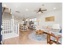 Bright, open living space with hardwood floors seamlessly connecting living and dining areas at 557 Blueway Ave, Summerville, SC 29486