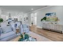 Spacious open-concept living area, featuring stylish decor, hardwood floors, and seamless flow for comfortable living and entertaining at 7416 Indigo Palms Way, Johns Island, SC 29455