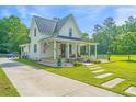Lovely two-story home with a covered porch and above-ground pool at 810 Highway 61, Ridgeville, SC 29472