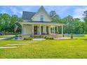 Charming two-story home featuring a spacious porch and an above-ground pool at 810 Highway 61, Ridgeville, SC 29472