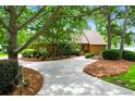 Charming home with well-maintained landscaping, beautiful trees, and a spacious driveway at 919 Overview Ct, Mount Pleasant, SC 29464