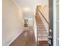 Inviting entryway with hardwood floors and staircase leading to the upper level at 9646 Scarborough Ct, Summerville, SC 29485