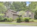 Well-maintained brick home with lush landscaping and a picturesque setting at 103 Kenninghall Rd, Goose Creek, SC 29445