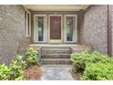 Inviting front porch with brick steps leading to the home's entrance at 103 Kenninghall Rd, Goose Creek, SC 29445