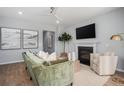 Cozy living room with fireplace, mounted TV, comfortable seating, and stylish decor at 104 Orchard Blossom Ln, Summerville, SC 29485