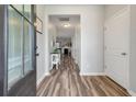 Inviting foyer with hardwood floors, leading to a living space with fireplace at 111 Nolin Road Rd, Moncks Corner, SC 29461