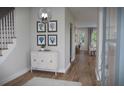 Inviting foyer with wood floors, stylish decor, and open view to the home's main living areas at 124 Maritime Way, Summerville, SC 29485