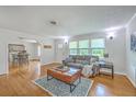 Bright living room featuring hardwood floors, neutral tones, and ample natural light at 1314 Cooper Store Rd, Moncks Corner, SC 29461