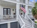 Welcoming porch with seating area and double door entryway, perfect for relaxing outdoors at 1489 Red Tide Rd, Mount Pleasant, SC 29466