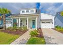 Inviting exterior view showcasing a well-manicured lawn and a pop of color from the blue front door at 1515 Pogonia St # 2, Mount Pleasant, SC 29466