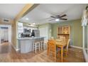 Open concept kitchen and dining area with granite countertops and stainless appliances at 1605 Live Oak Park, Seabrook Island, SC 29455