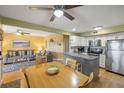 Open-concept living and dining space, featuring a kitchen island and stainless appliances at 1605 Live Oak Park, Seabrook Island, SC 29455