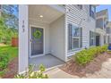 Close-up view of a townhome entrance featuring a decorative wreath on the front door at 163 Spencer Cir, Summerville, SC 29485