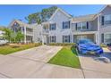 Lovely townhome featuring a well-maintained lawn and a private parking area at 163 Spencer Cir, Summerville, SC 29485
