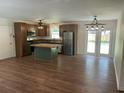 Open kitchen and dining area featuring wood cabinets, stainless appliances, and an island at 2 Clarksville Ln, Goose Creek, SC 29445