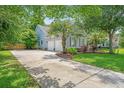 The home features an attached two-car garage and a long driveway at 2031 Thornhill Dr, Summerville, SC 29485