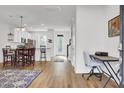 Open-concept living area with hardwood floors, dining table, and a bright, airy atmosphere at 208 Kirkland St, Goose Creek, SC 29445