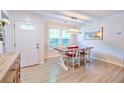 Dining area featuring tile floors and a pendant light above a wood and white table at 209 Apache Dr, Summerville, SC 29483