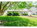 Beautiful home featuring a well-manicured lawn, lush landscaping, and inviting curb appeal at 209 Apache Dr, Summerville, SC 29483