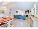 Bright living room with tile floors, a fireplace, ceiling fan, and a comfortable sofa at 209 Apache Dr, Summerville, SC 29483