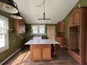Bright kitchen showcasing a central island, ample cabinet space, and a view of the exterior at 2204 Dover St, North Charleston, SC 29405