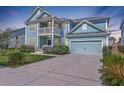 Lovely two-story home features a two-car garage, second-floor porch, and manicured landscaping at 2336 Brinkley Rd, Johns Island, SC 29455