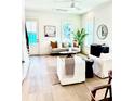Bright living room with white walls, hardwood floors, and modern furniture at 25 Nats Ct, Charleston, SC 29403