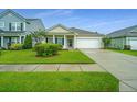 Inviting single-story home with a neatly landscaped front yard and a convenient attached one car garage at 254 Mayfield Dr, Goose Creek, SC 29445