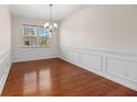 Bright dining room featuring hardwood floors, large windows and classic wainscoting at 272 Overcup Loop, Summerville, SC 29486