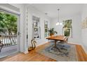 Bright dining room features hardwood floors, natural light, and a stylish rug at 3000 Treadwell St, Mount Pleasant, SC 29466