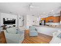 Open living room with hardwood floors, bright white walls, and easy access to kitchen at 3000 Treadwell St, Mount Pleasant, SC 29466