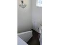 Bright entryway featuring hardwood floors, a white door with sidelight, and a staircase leading to the upper level at 3706 Blackjack Rd, Ladson, SC 29456