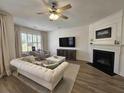 Cozy living room with fireplace, television, and abundant natural light at 4013 Conant Rd, Mount Pleasant, SC 29466