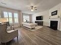 Bright living room with fireplace, large windows, and neutral decor at 4013 Conant Rd, Mount Pleasant, SC 29466
