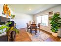 Cozy dining room featuring a wooden table and chairs, with ample natural light from the nearby window at 619 Red Mulberry Rd, Moncks Corner, SC 29461