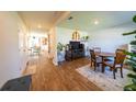 Spacious dining room with wood floors, a decorative rug, and a dining table with four chairs at 619 Red Mulberry Rd, Moncks Corner, SC 29461